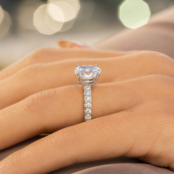 side profile of silver oval cut engagement ring 