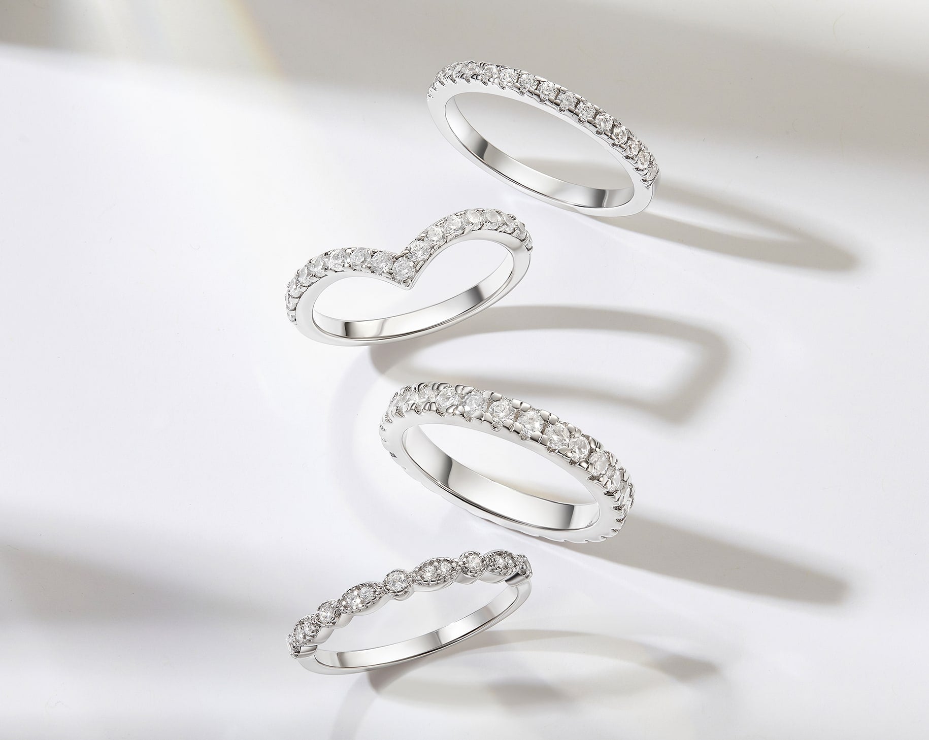 beautiful silver wedding bands on white gray background