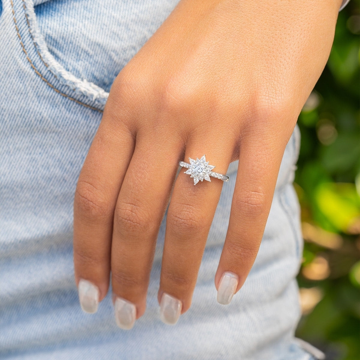 Star-like engagement ring with silver band.