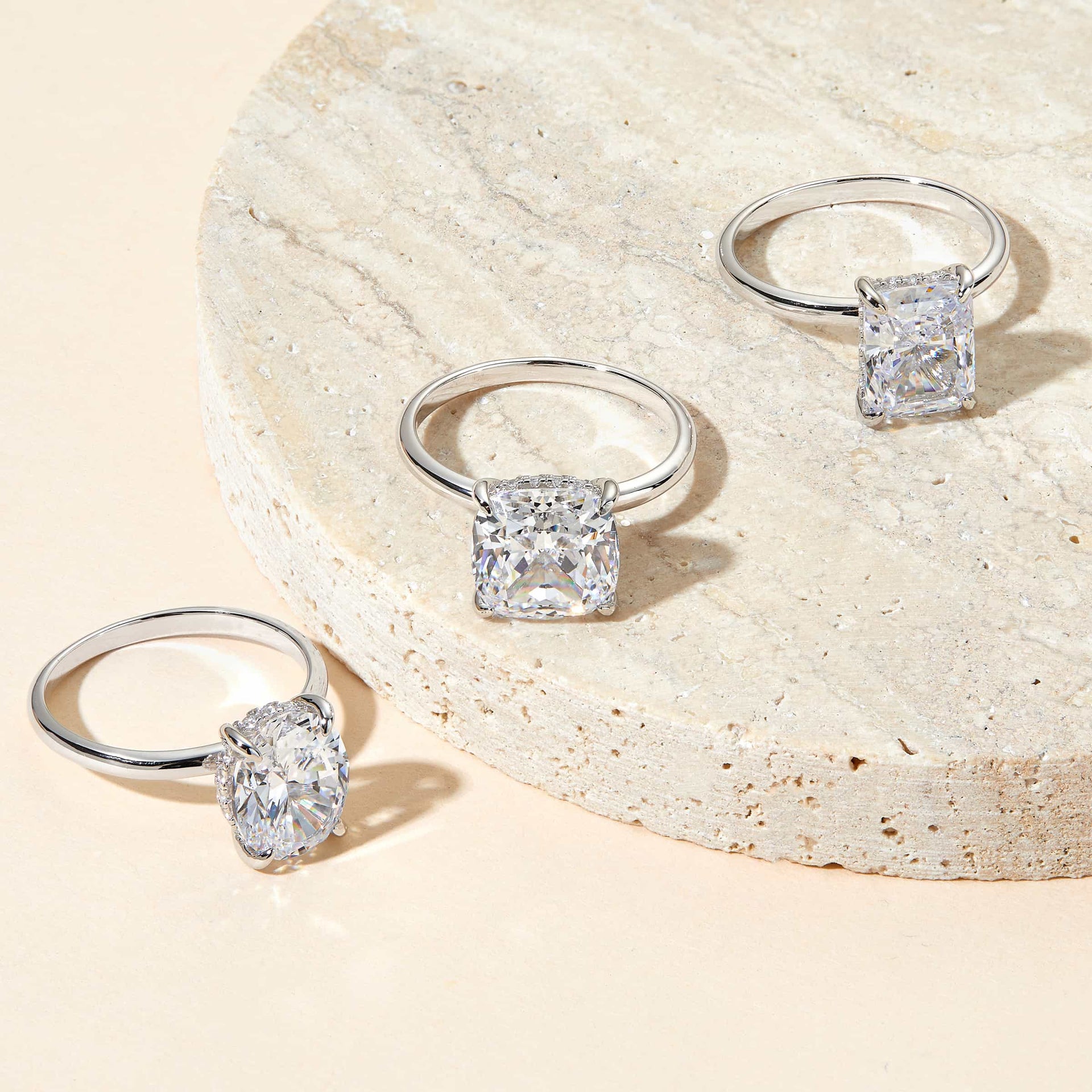 silver solitaire engagement rings flatlay