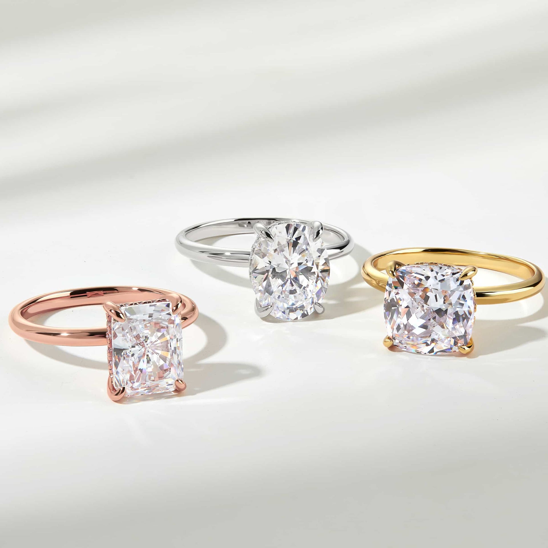solitaire engagement rings in rose gold, silver, gold