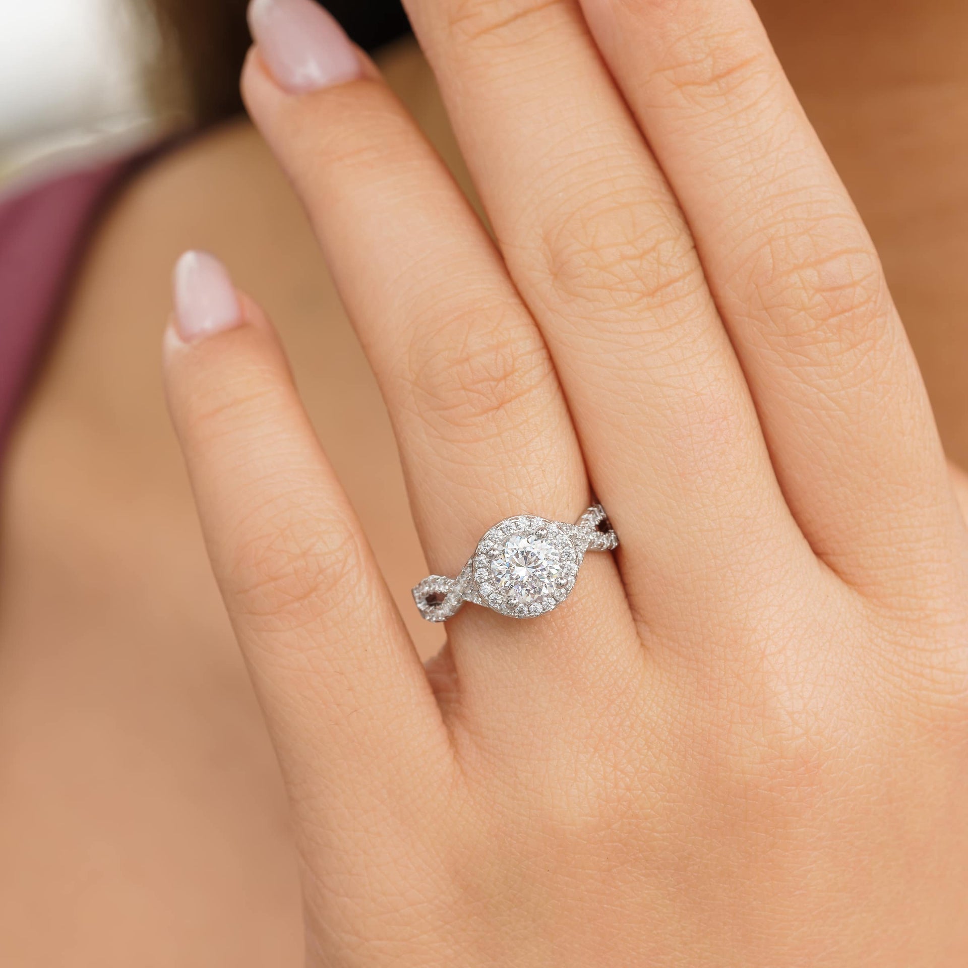 woman wearing silver vintage engagement ring