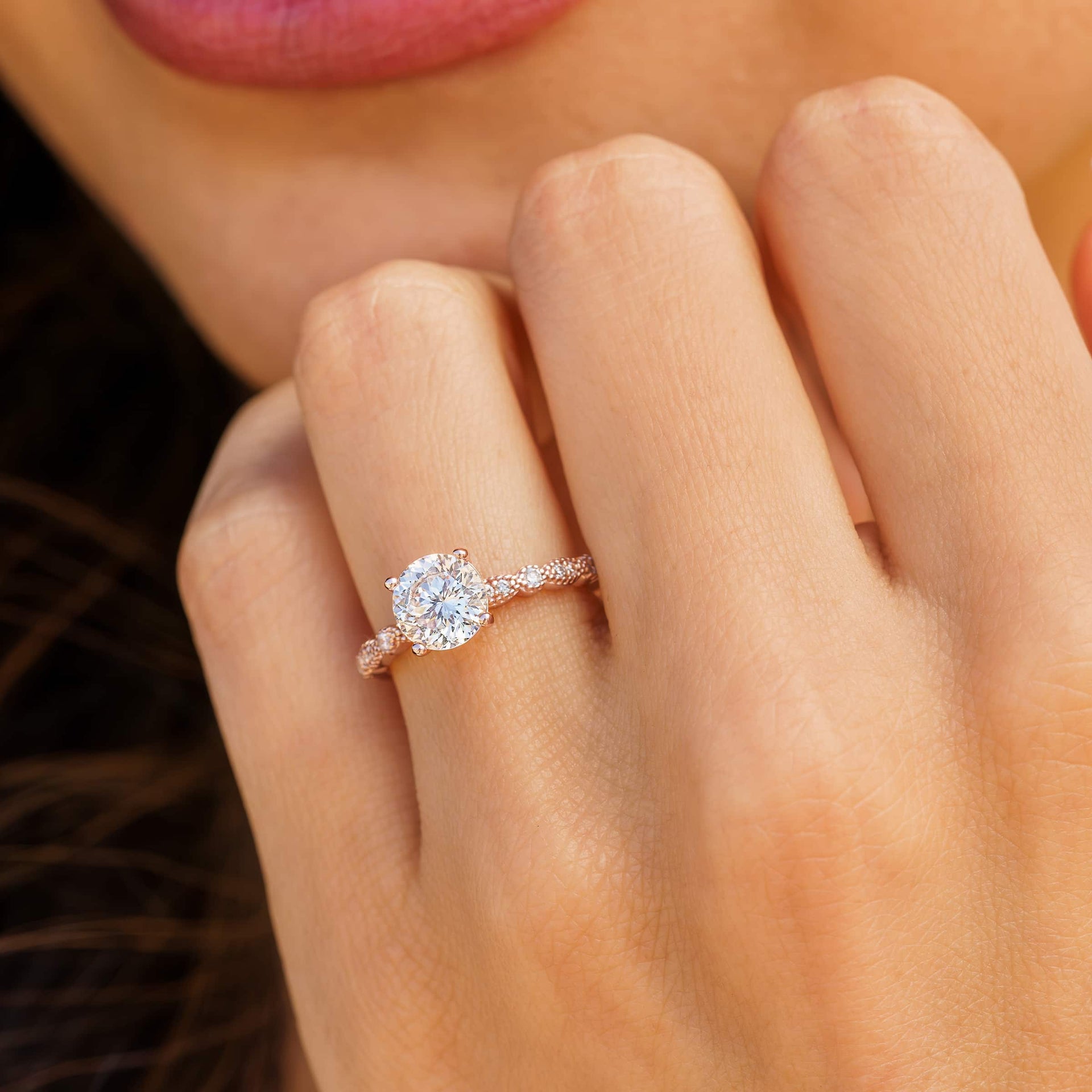 vintage rose gold engagement ring on woman's finger