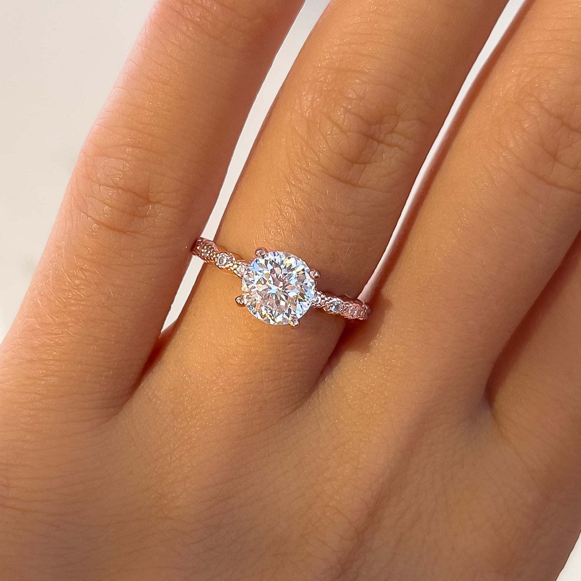 1.5 round ct affordable engagement ring on ladies hand