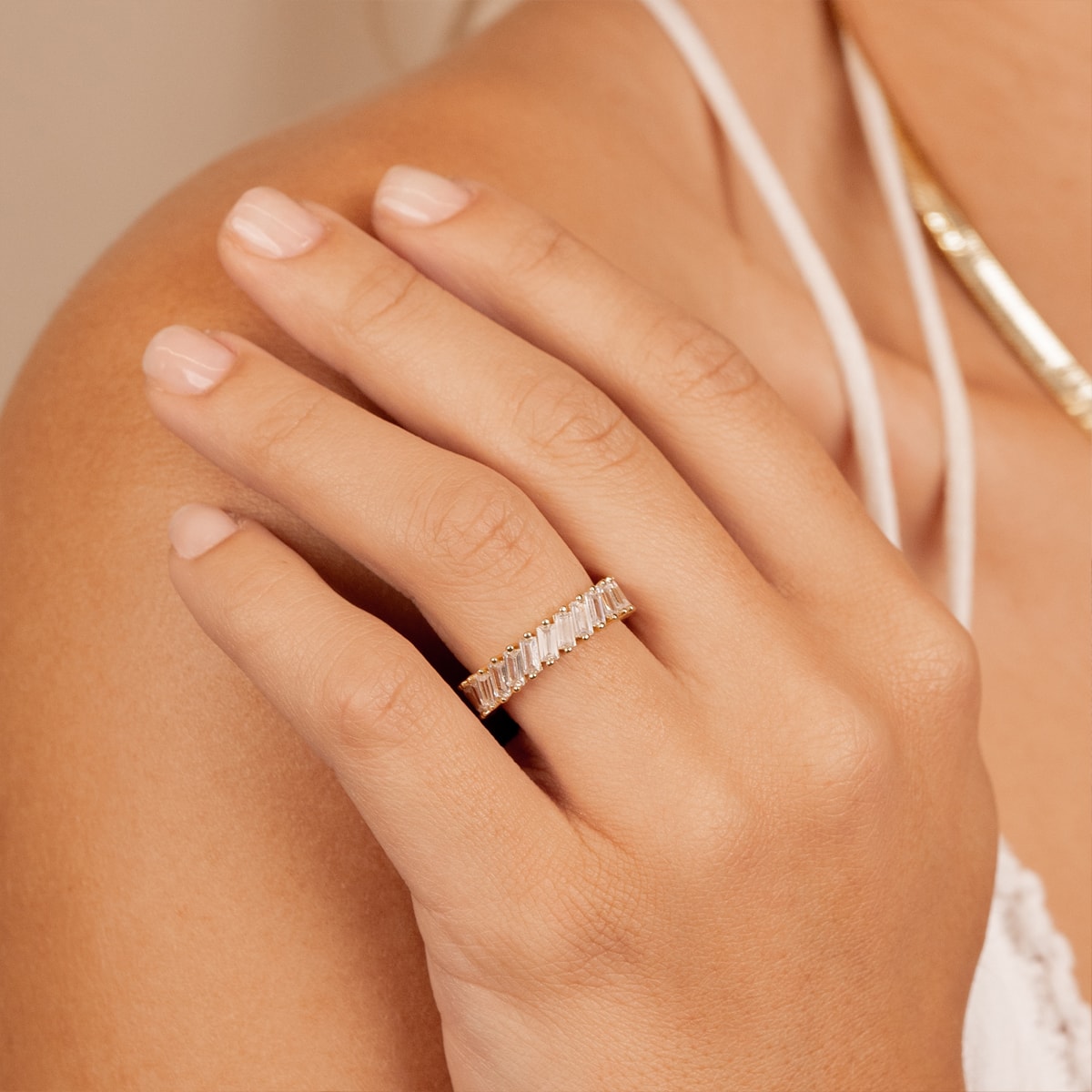 Woman wearing baguette stone eternity ring 