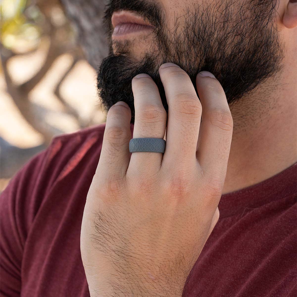 Male Hand wearing a unique gray rubber wedding ring