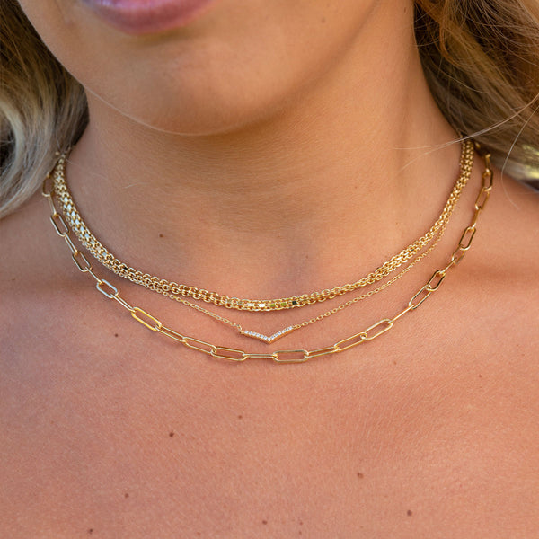 Beautiful gold chain layered necklaces on model