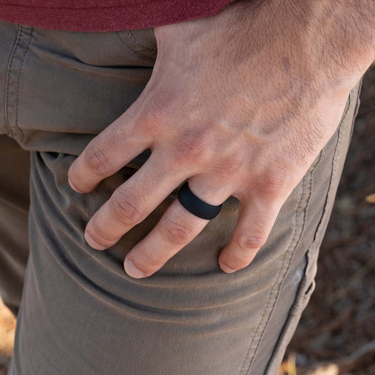 Comfortable black silicone wedding ring on a male hand
