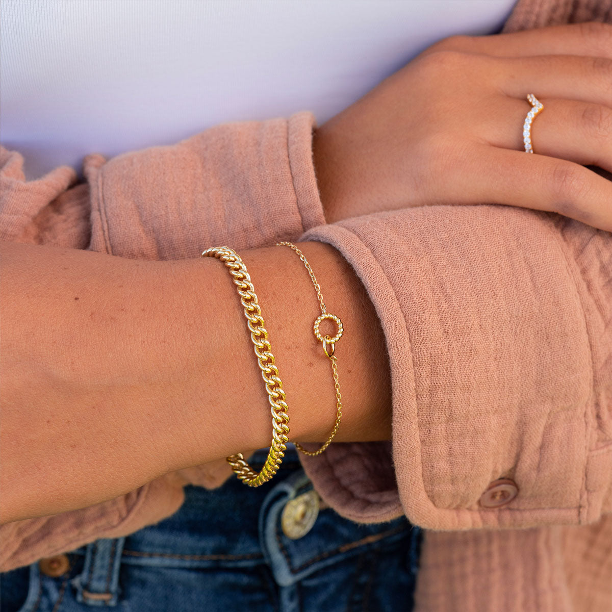 Cute gold layered chain bracelets on model