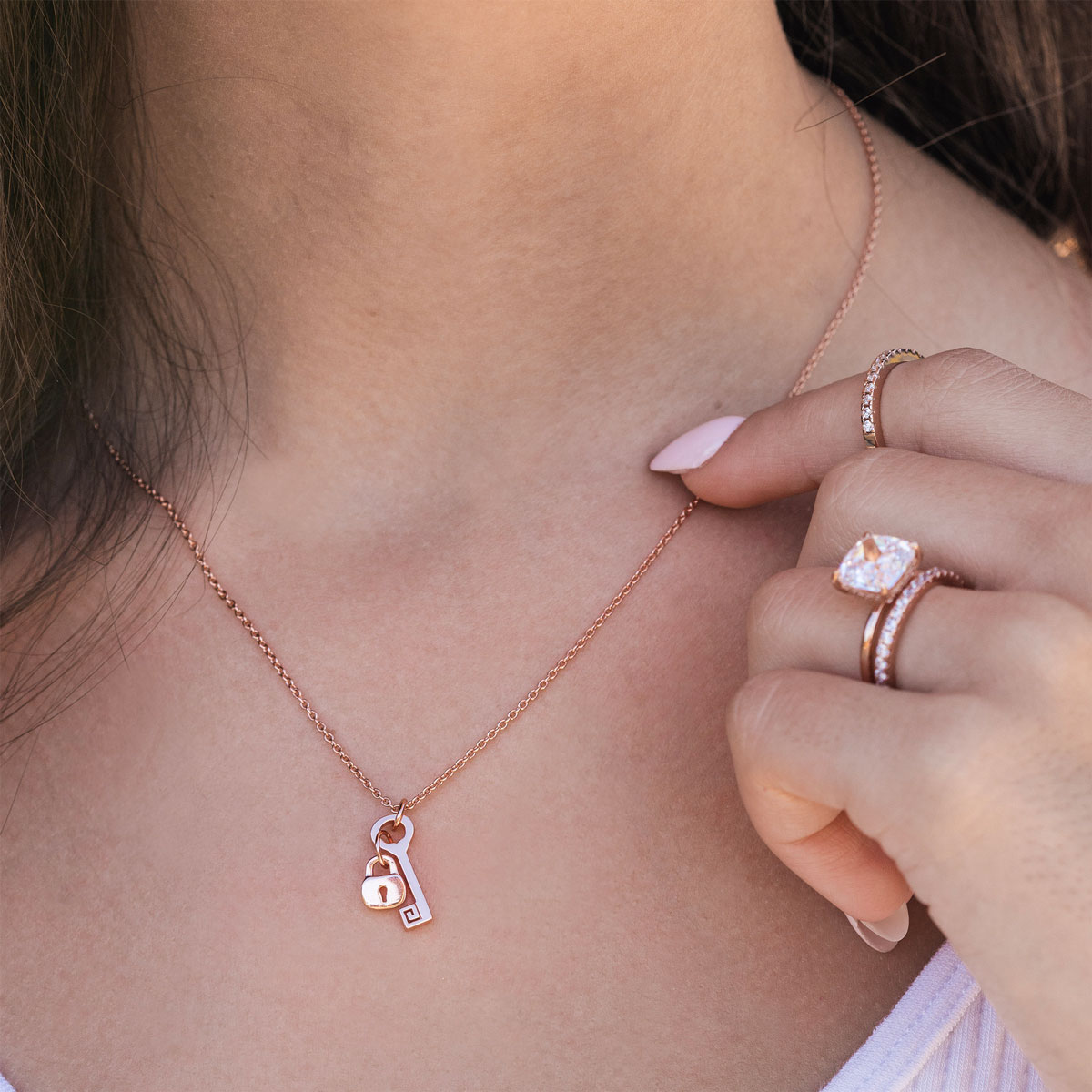 Cute rose gold lock and key necklace on model