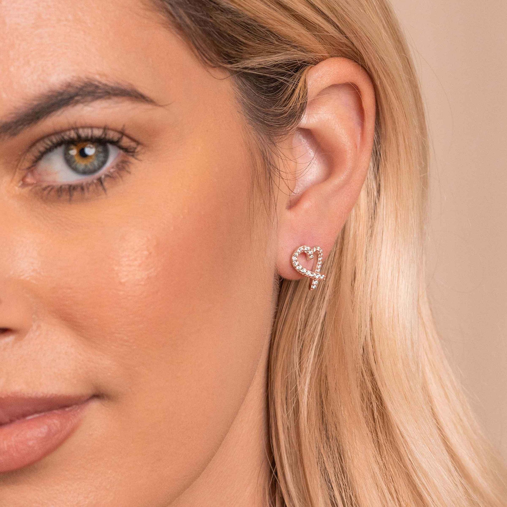 Cute womens heart shaped earrings on model