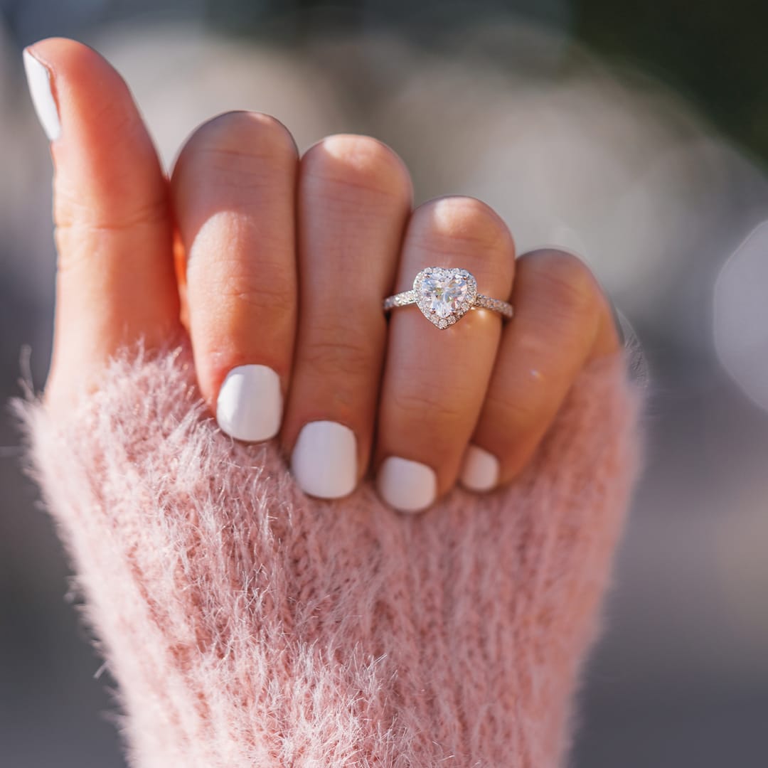 lady wearing heart shaped sweetheart engagement ring