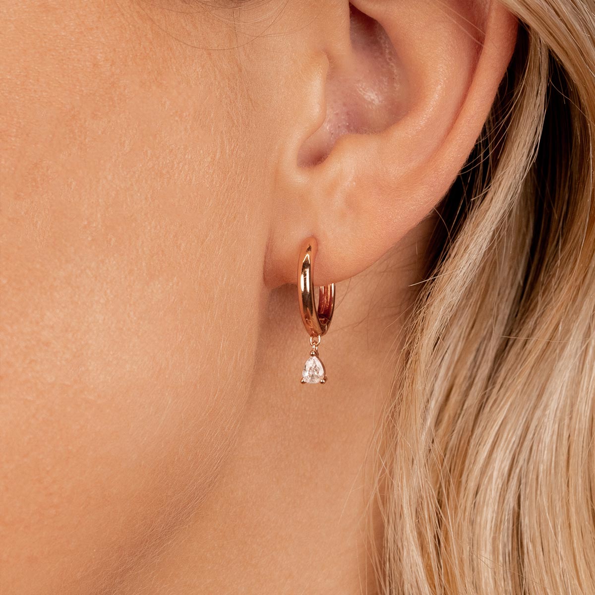 Rose gold hoop earrings with pendant