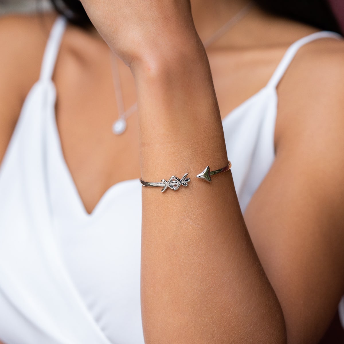 the hope silver bangle with cupid arrow