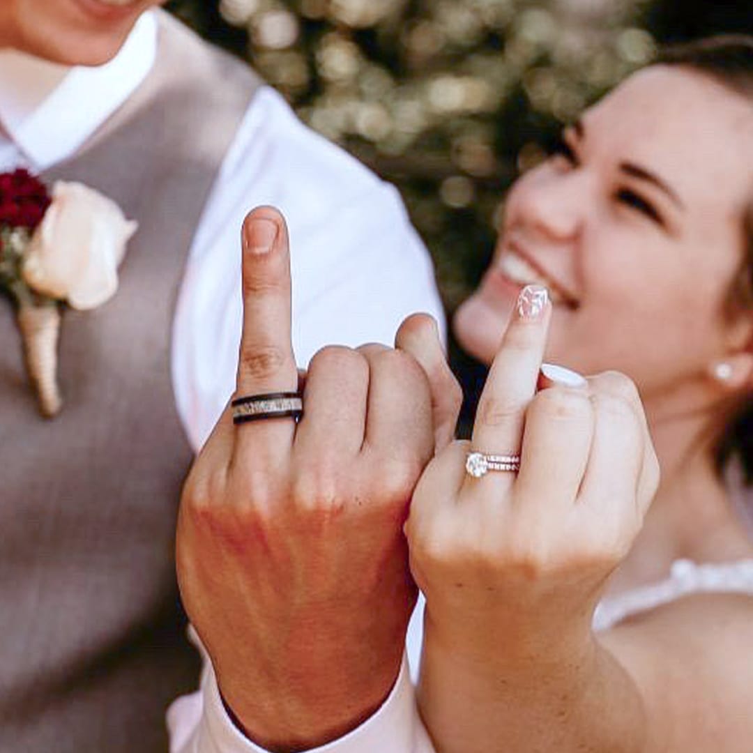 wedding couple wearing wedding rings