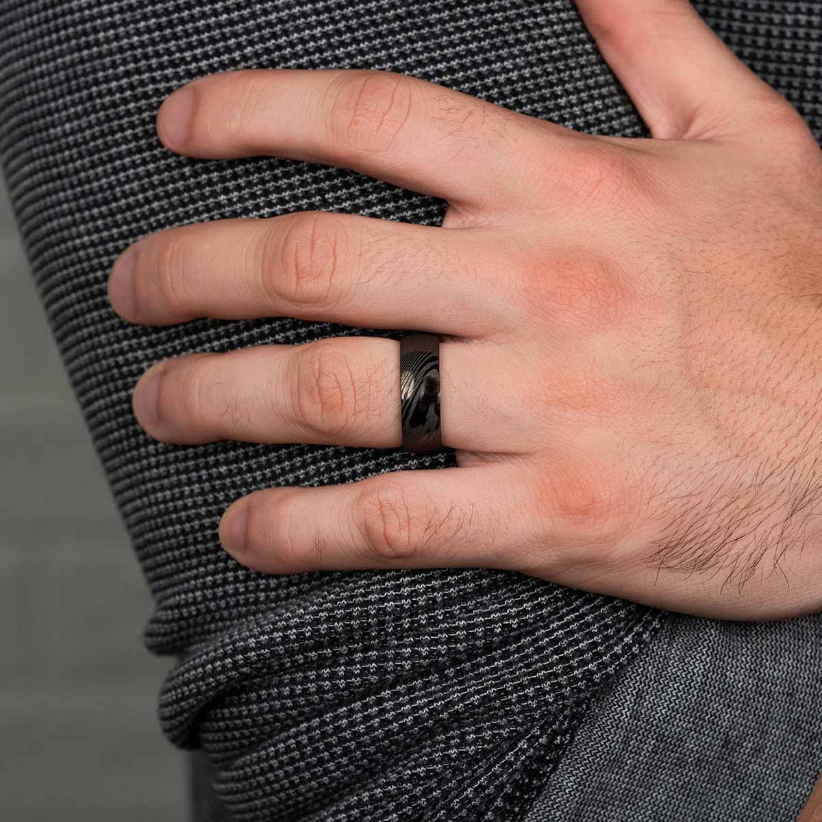 Affordable mens black wedding ring on hand