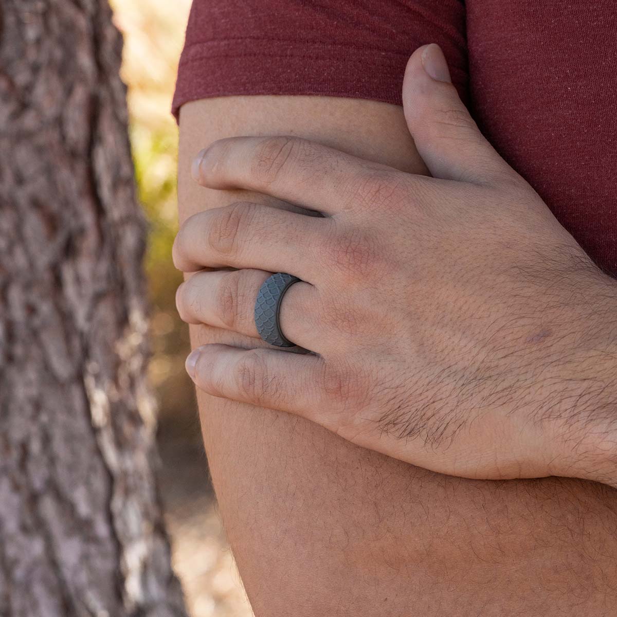 Gray silicone patterned wedding ring on a male hand