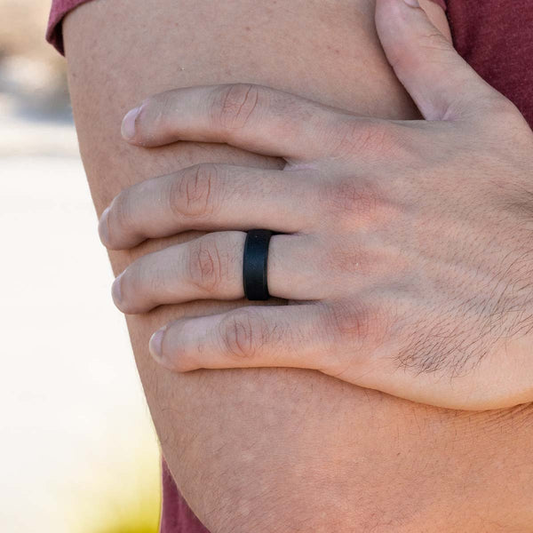 Silicone ring with beveled edges on a male hand