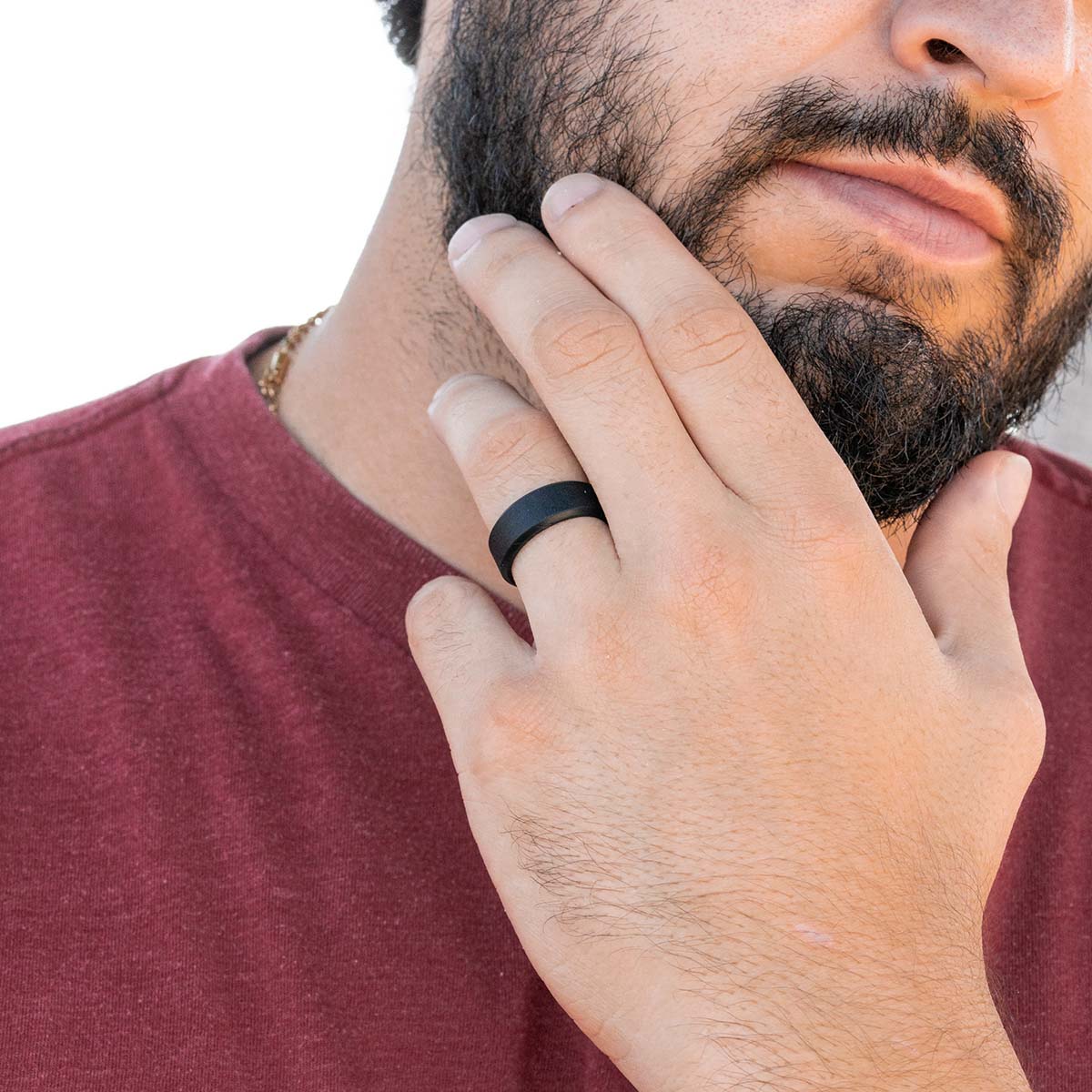Man wearing thick black silicone ring