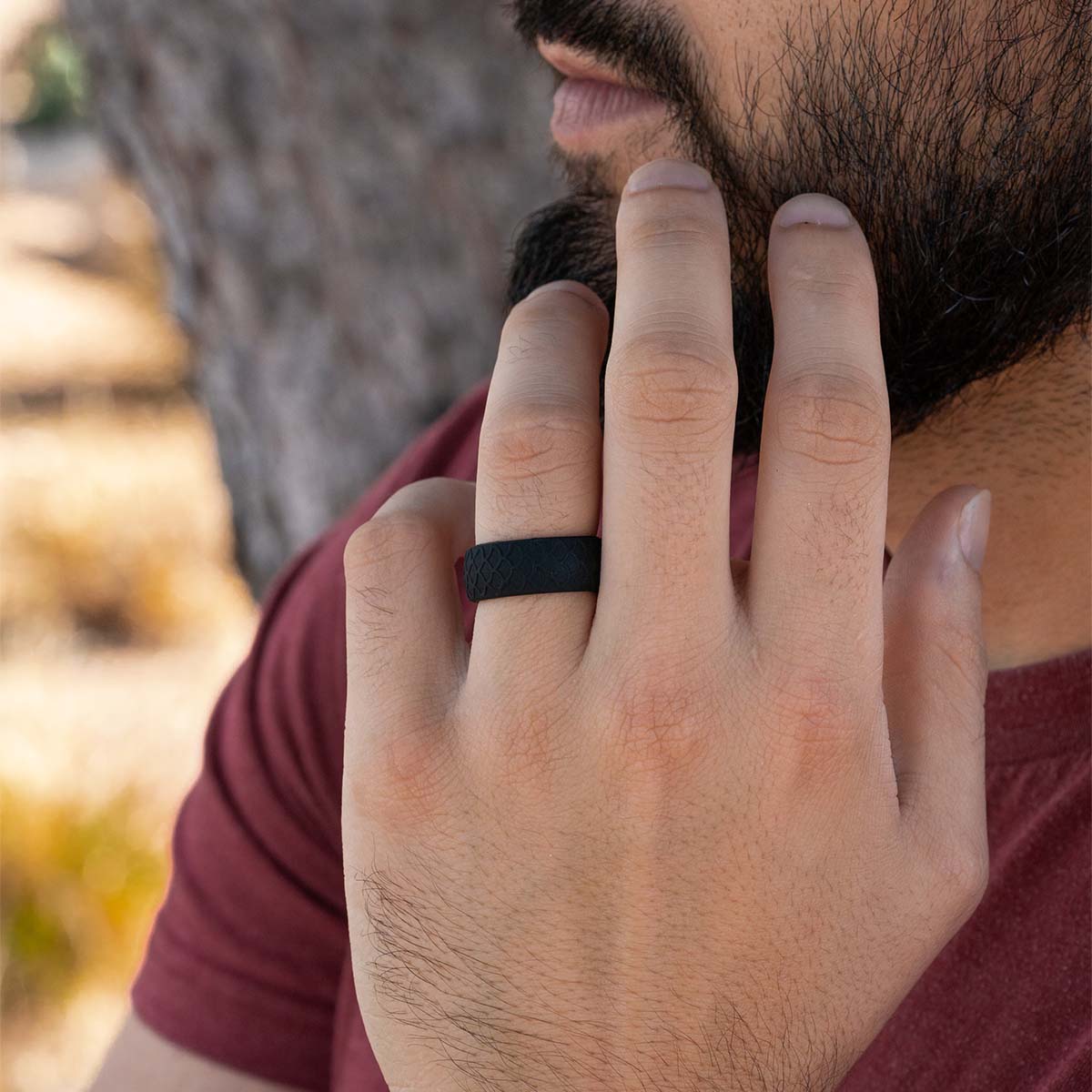 Comfortable black silicone wedding ring on a male hand