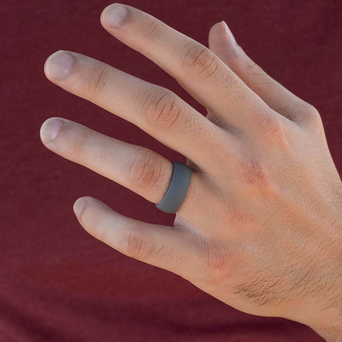 Gray silicone wedding ring on a male hand