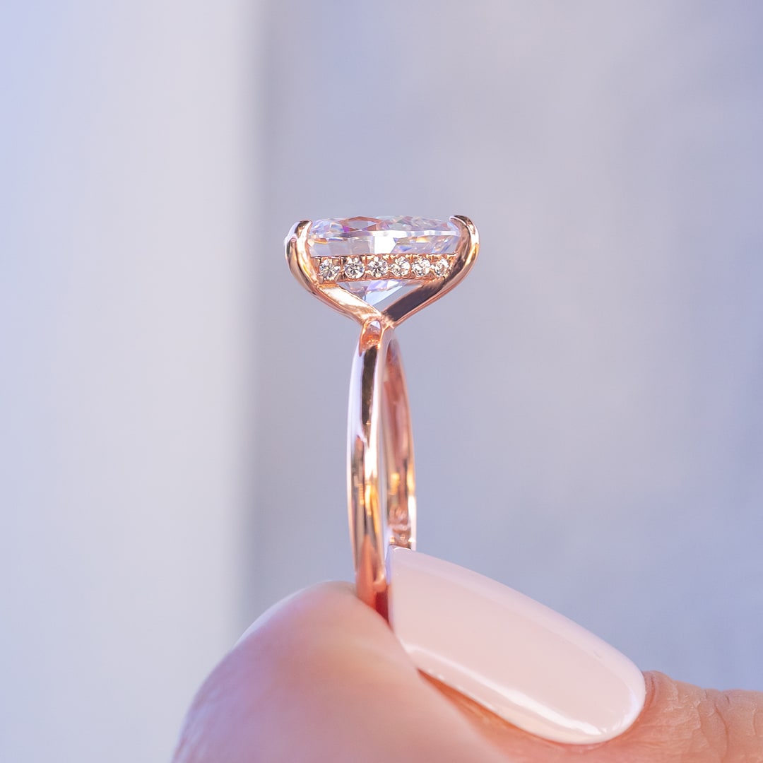 Side profile of rose gold hidden halo engagement ring