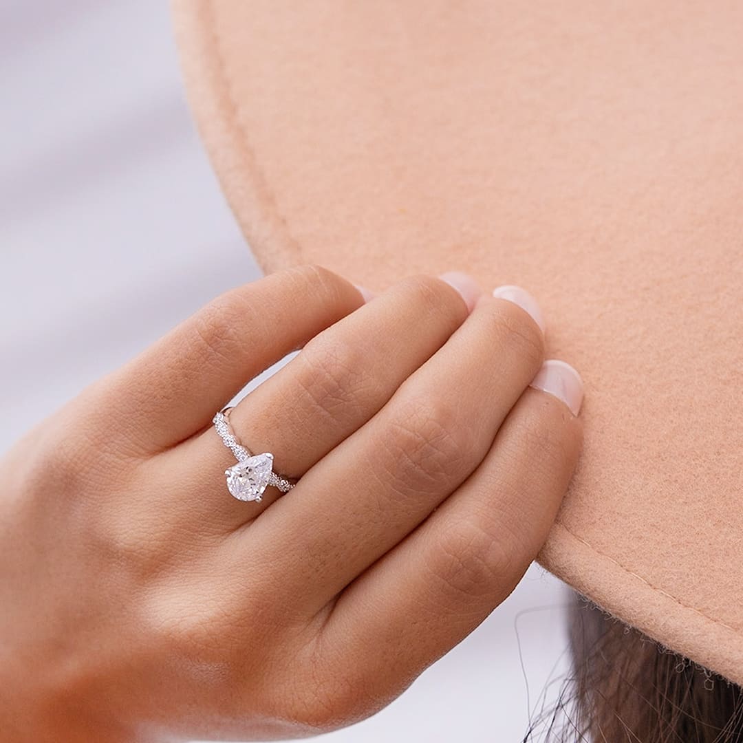 lady wearing the scarlett vintage pear cut engagement ring
