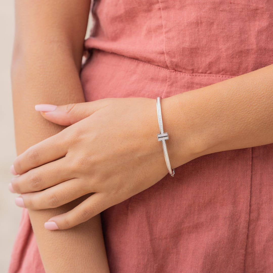 the gia silver bangle on womens wrist