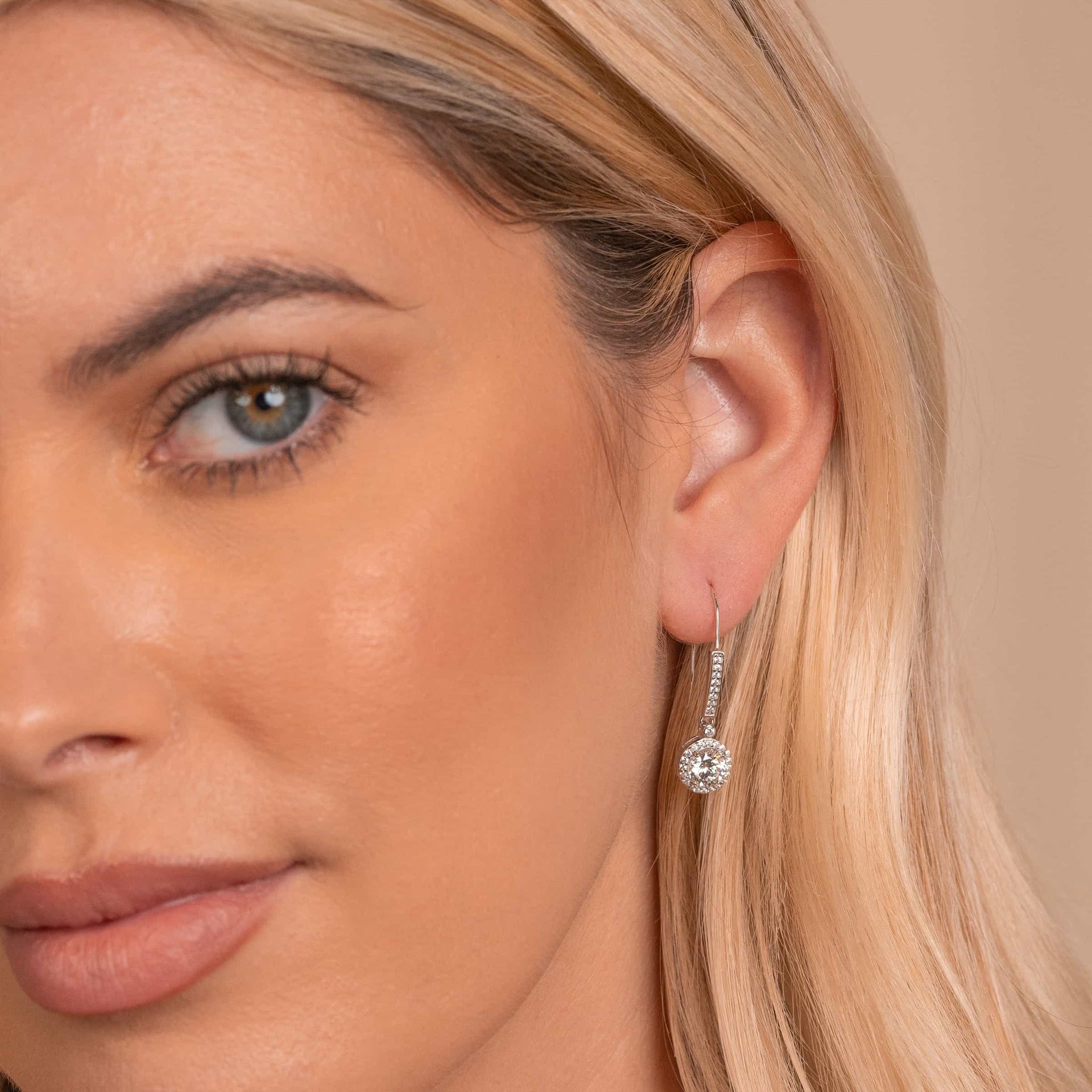 Bridal silver earrings on model