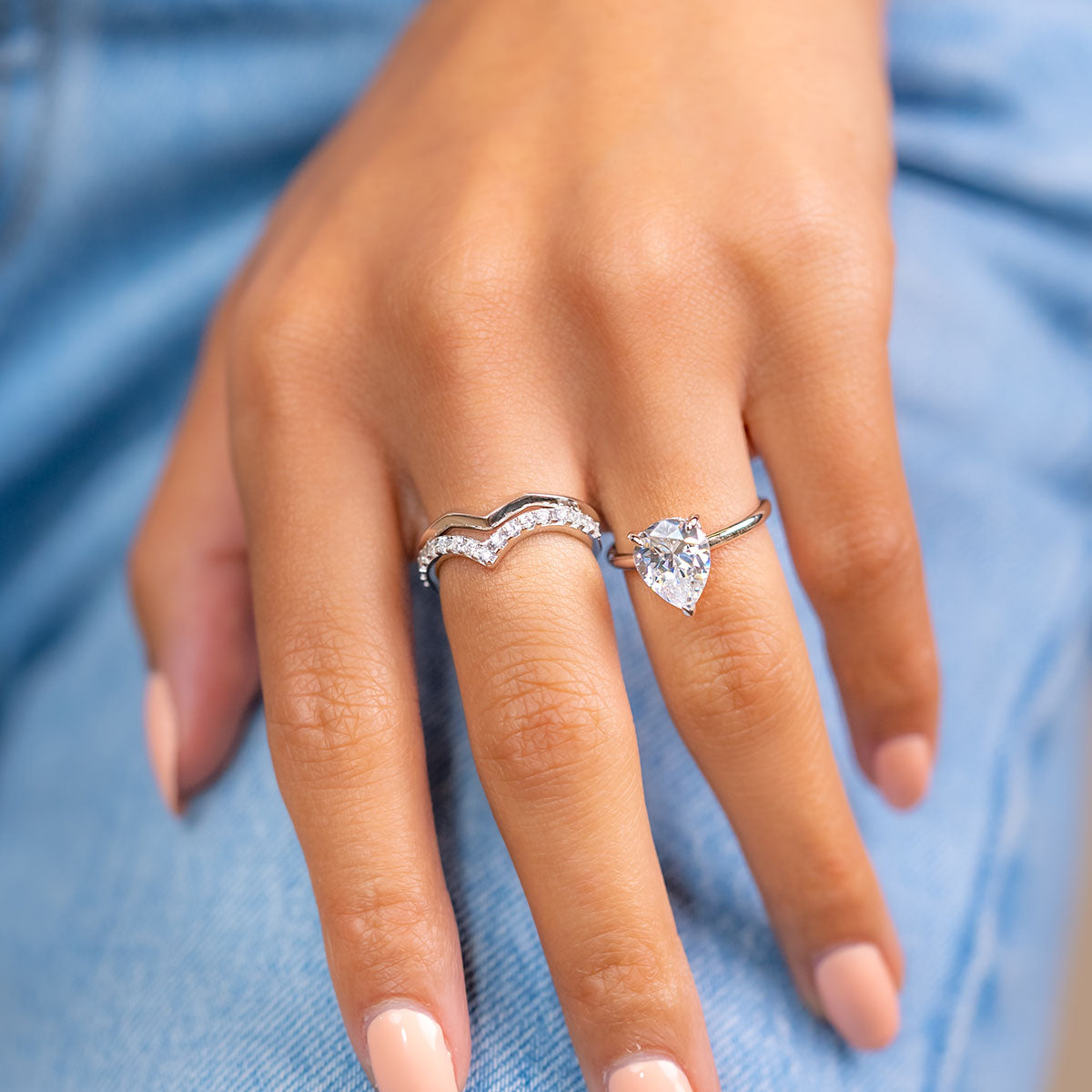 Female hand wearing sterling silver engagement ring