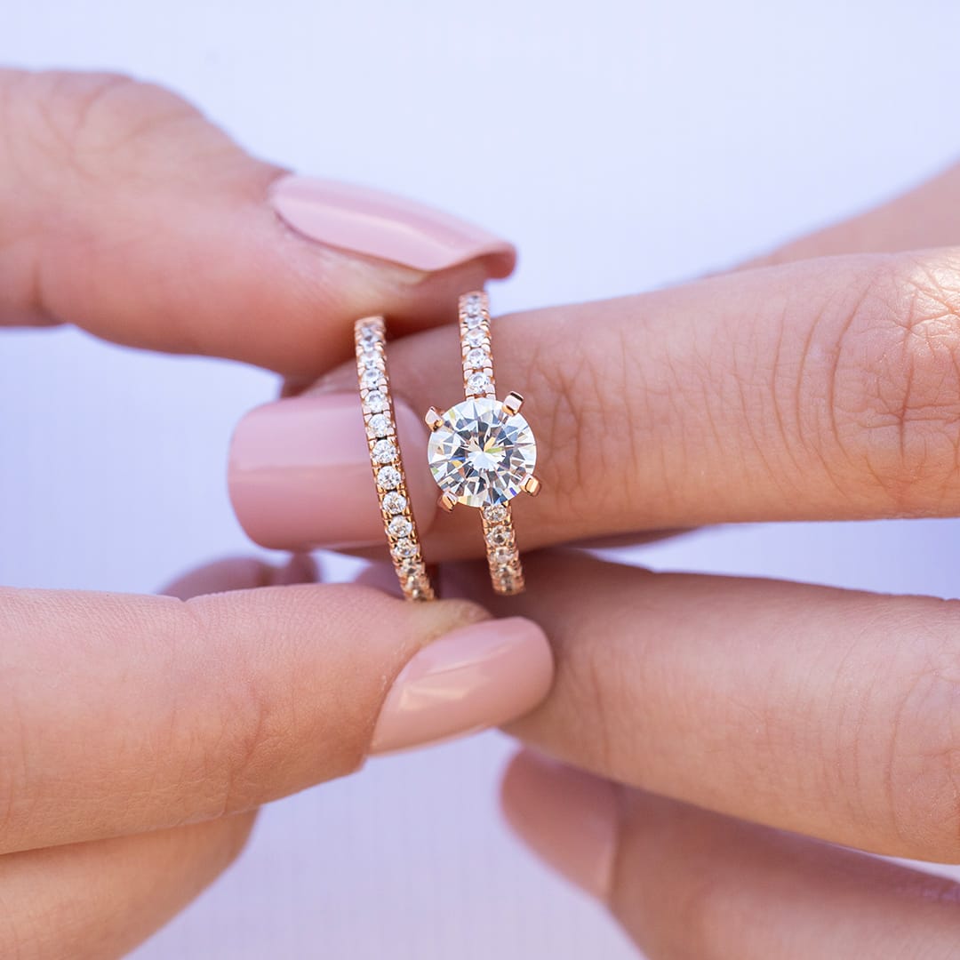 the desire rose gold band paired with engagement ring