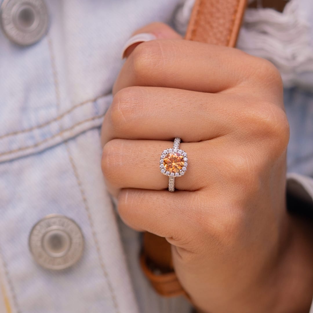 the halo morganite engagement ring on ladies hand