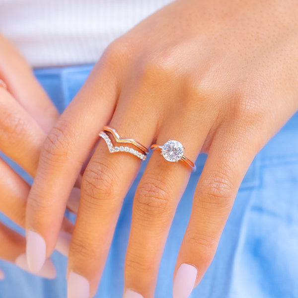 Rose gold round cut engagement ring with bands