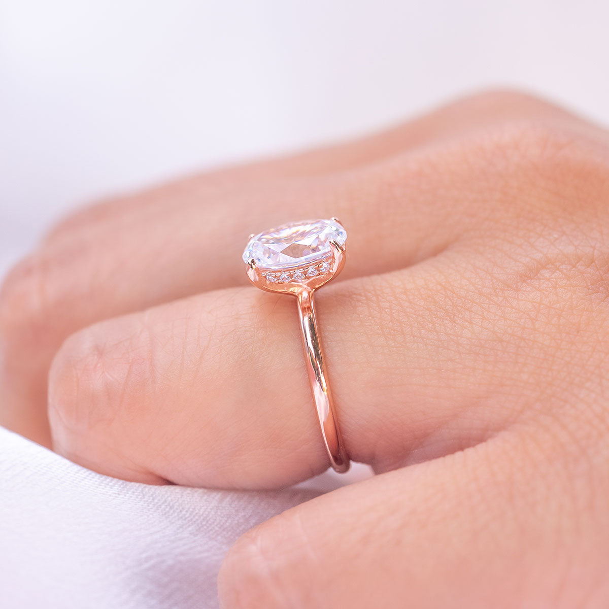 Rose gold round cut engagement ring with hidden halo