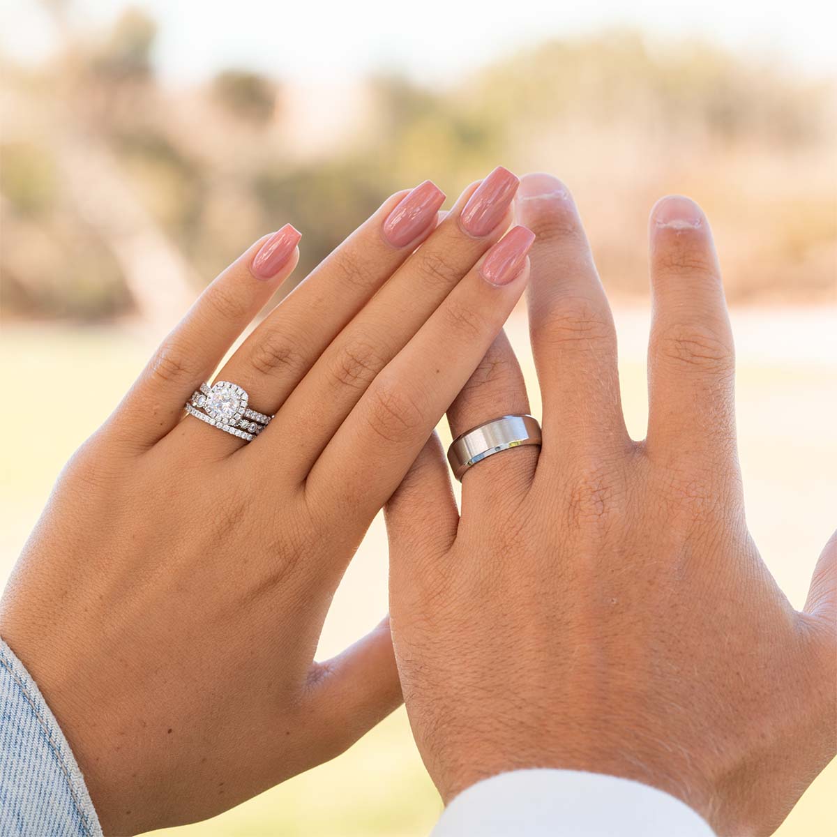 Couple wearing silver wedding rings