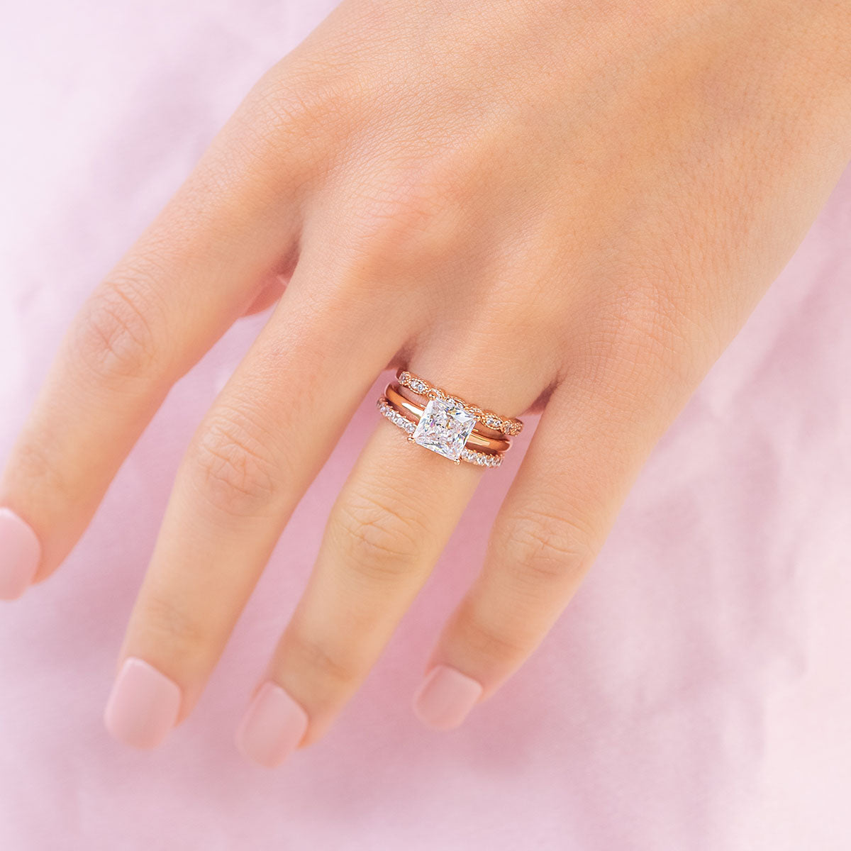 Rose gold princess cut engagement ring on model