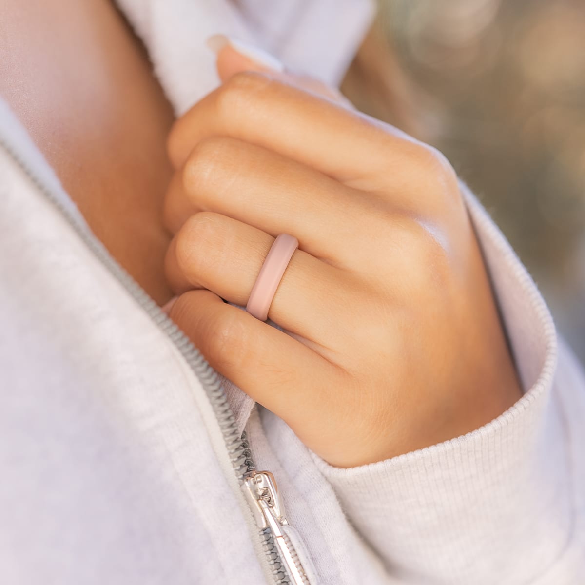 Athletic woman wearing a pink silicone ring