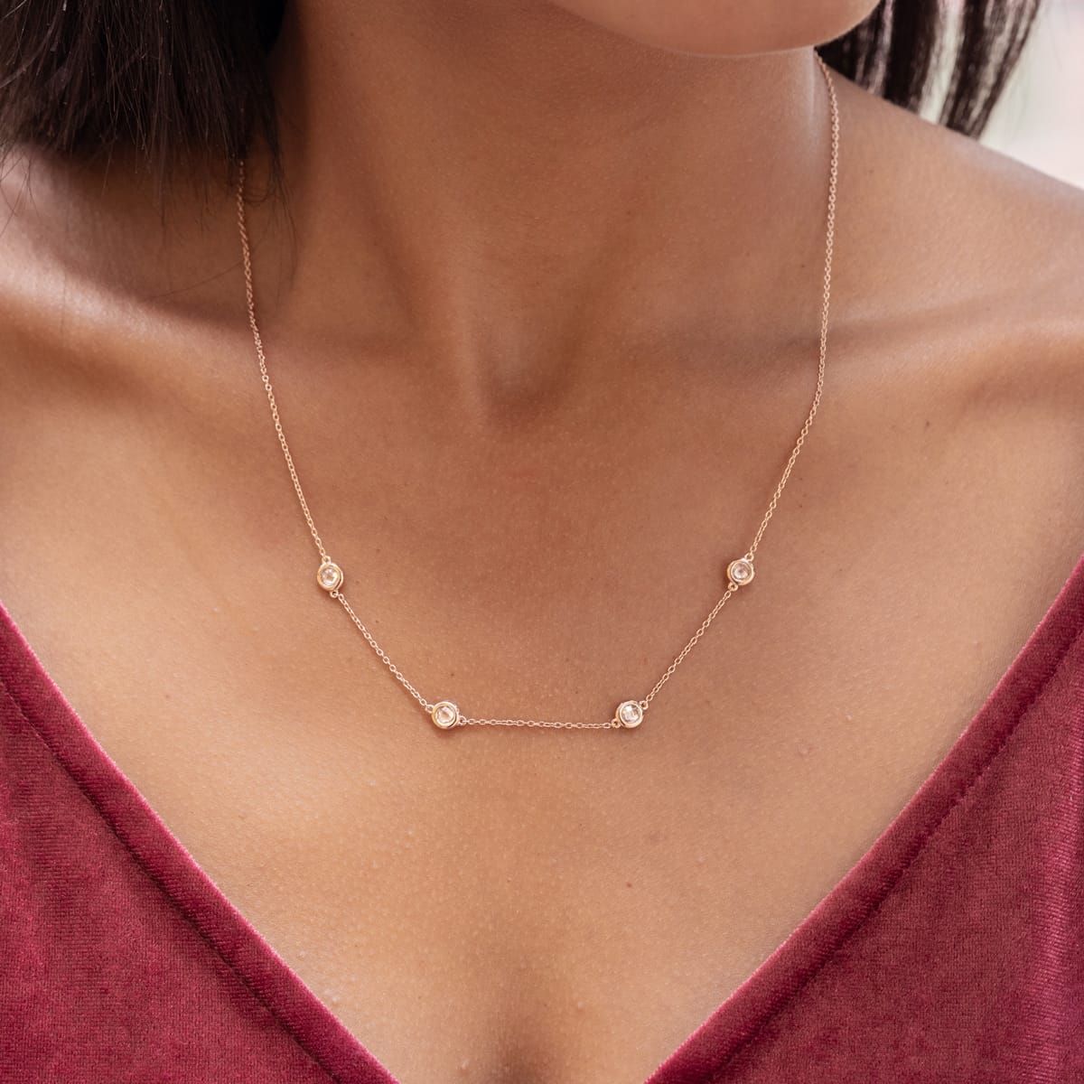 the kali rose gold necklace on ladies neck