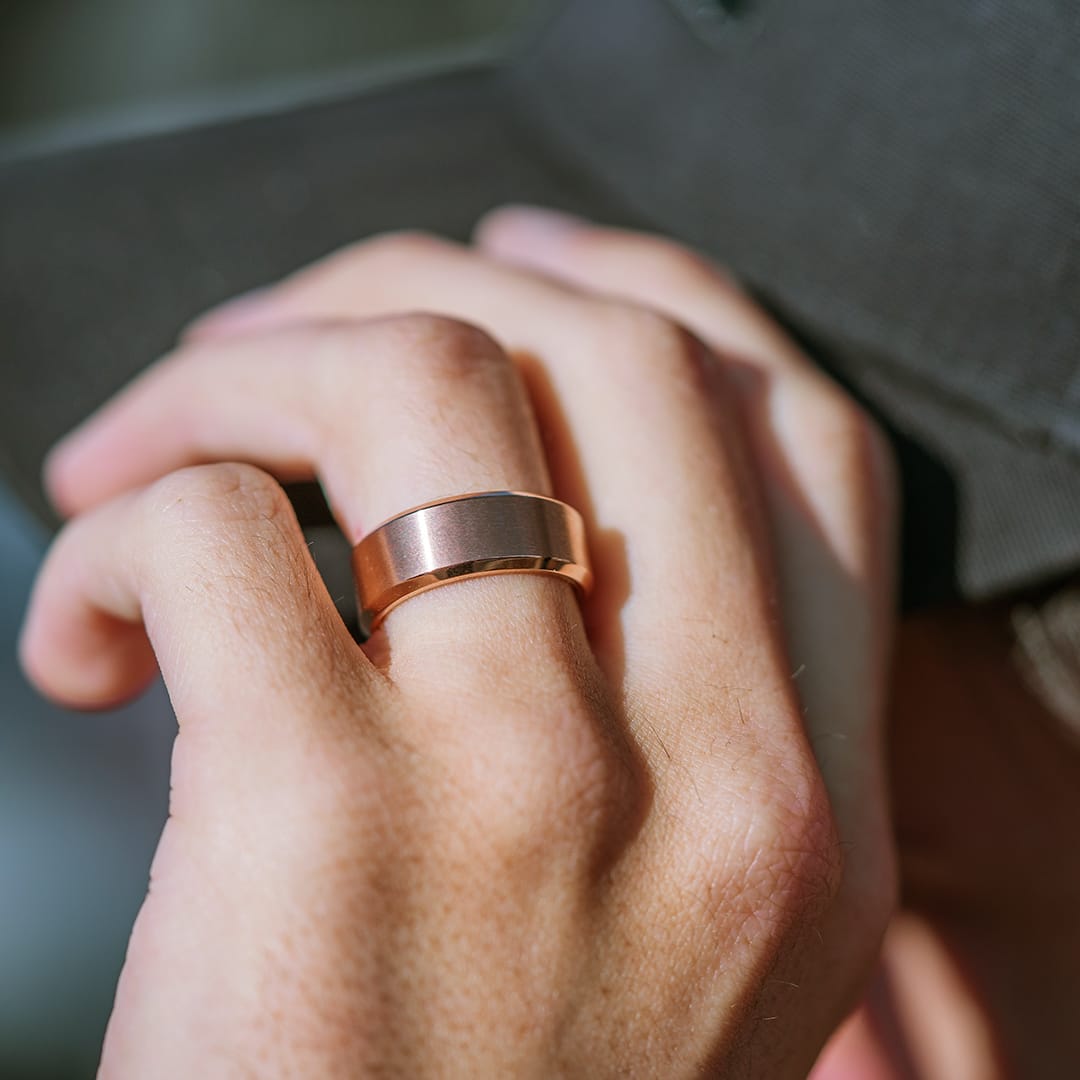 the titan rose gold mens wedding ring on hand