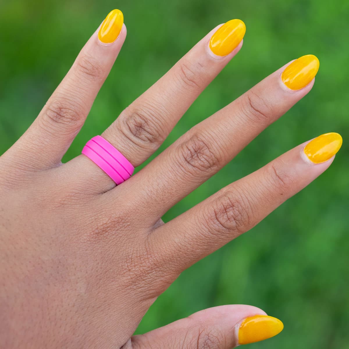 lady wearing the ultraflex pink silicone wedding ring