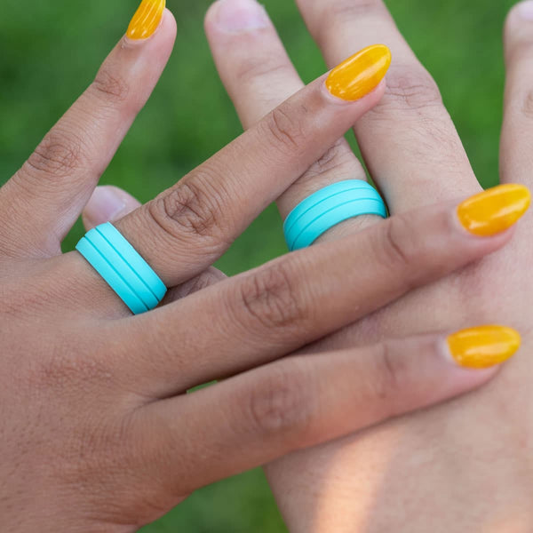 couple wearing the ultraflex teal silicone wedding ring