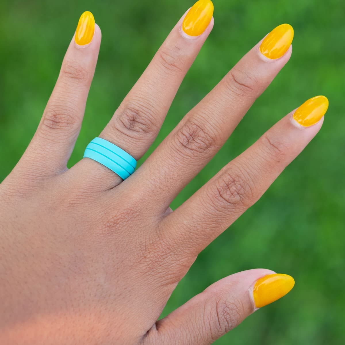 the ultraflex teal silicone wedding ring on hand