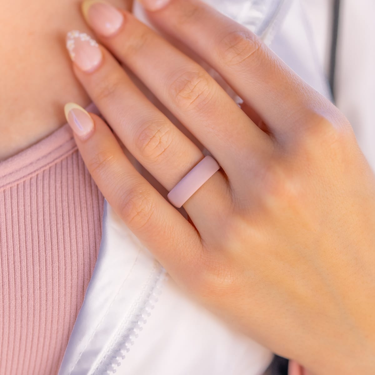 Athletic woman wearing a pink rounded silicone wedding ring