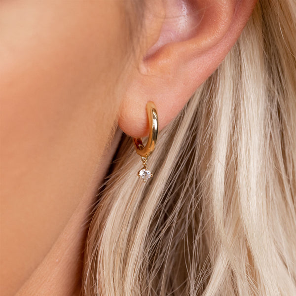 Small gold huggie earrings with stone
